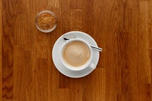 walnut worktop with a cup of coffee on it